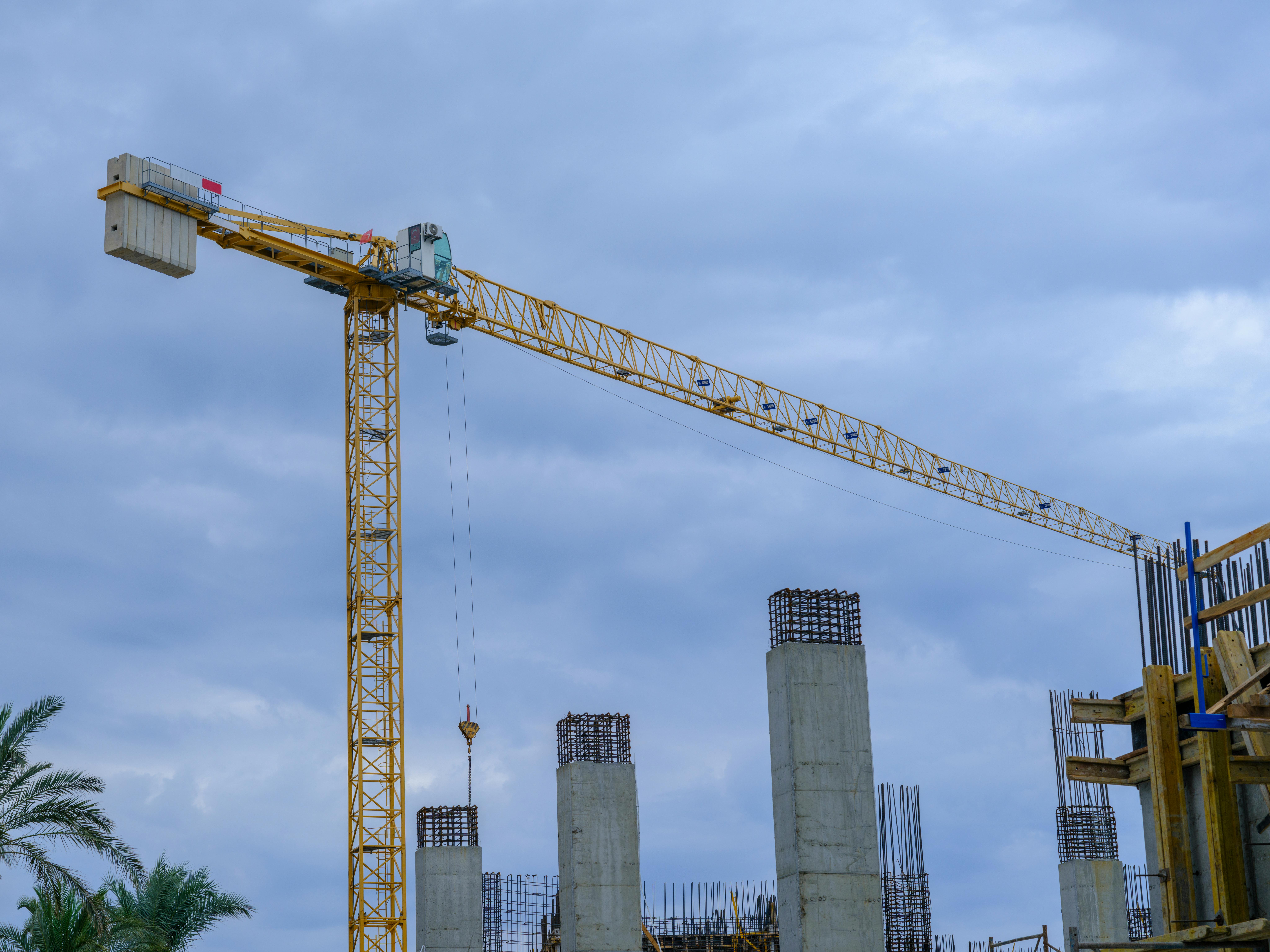 Tower crane and concrete columns at a construction site