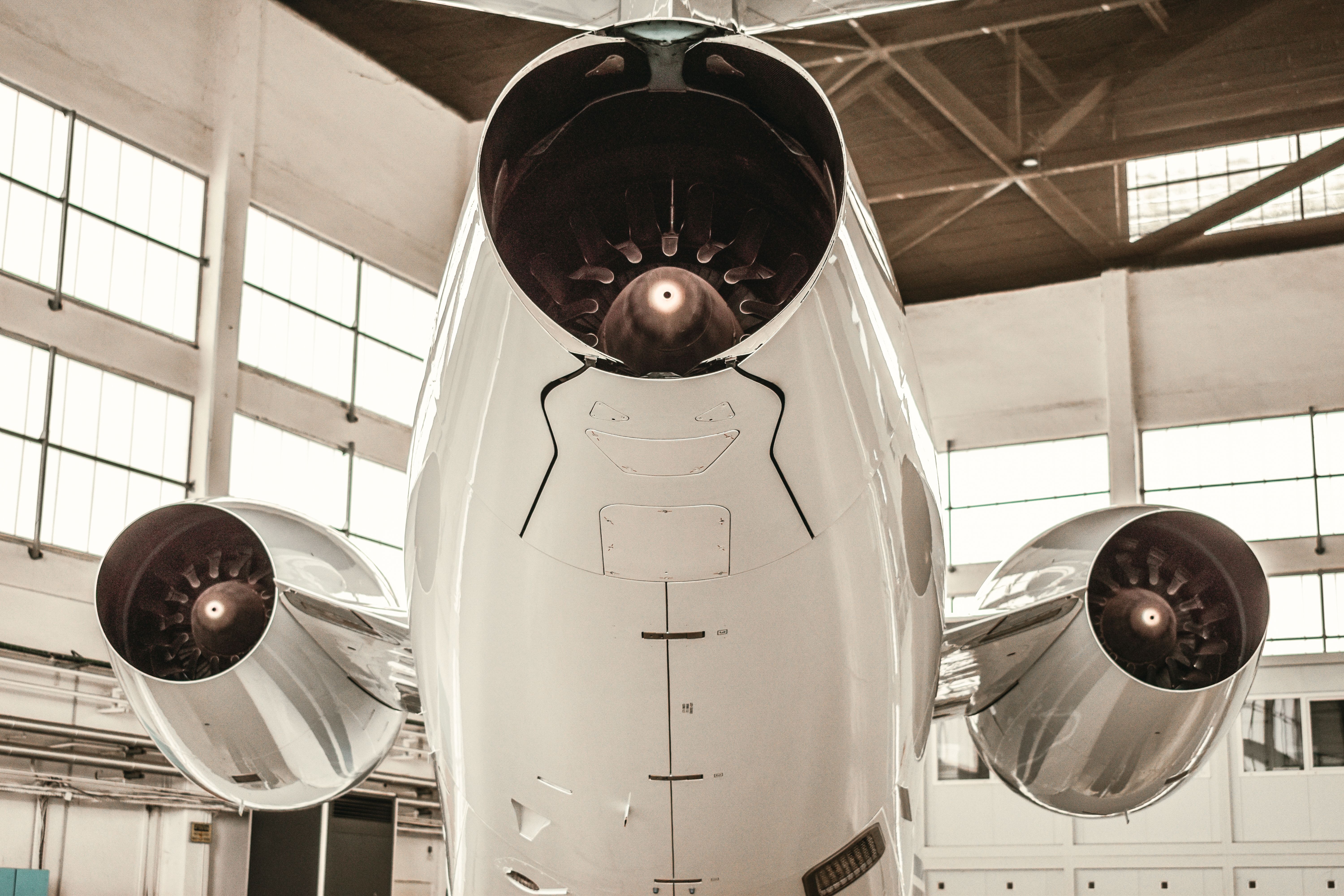 Aircraft jet engines undergoing maintenance in a hangar