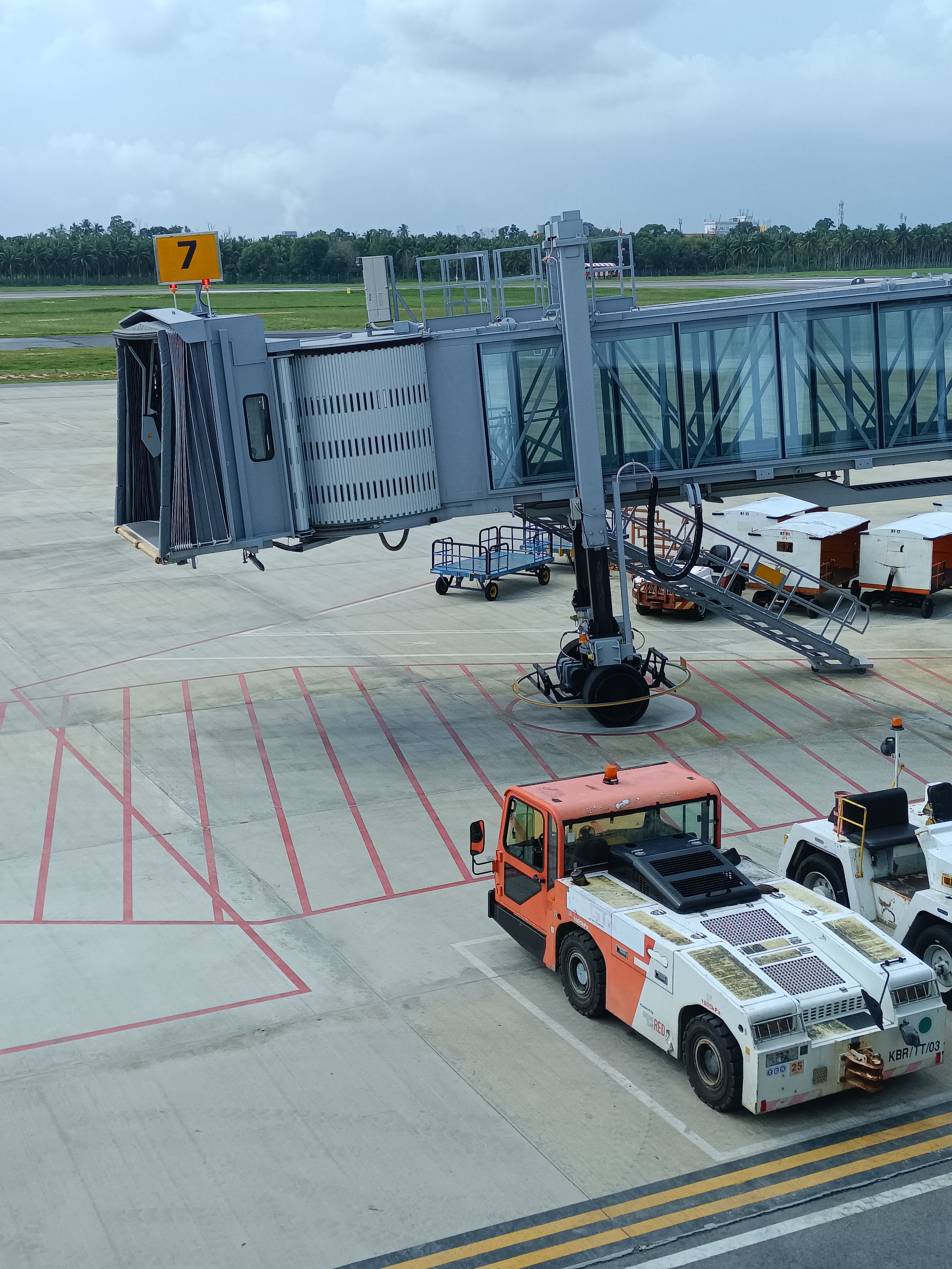 Airport apron with service vehicles and logistics operations