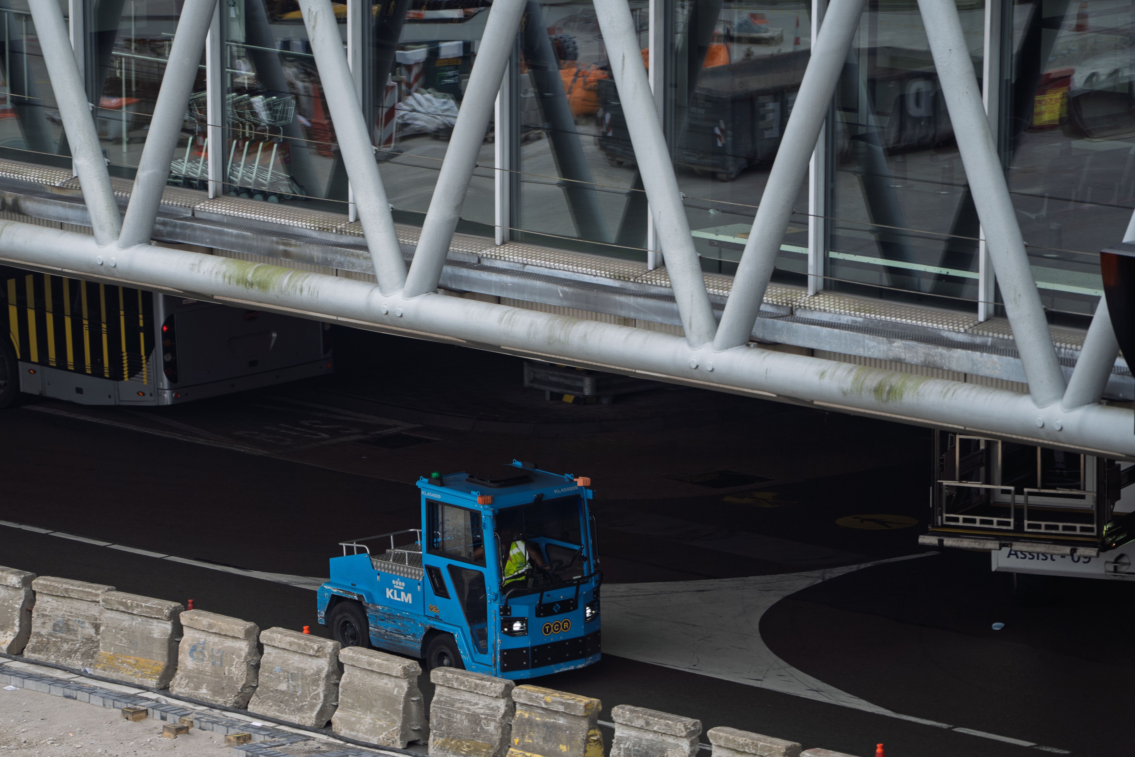 Airport ground-handling vehicle servicing an aircraft