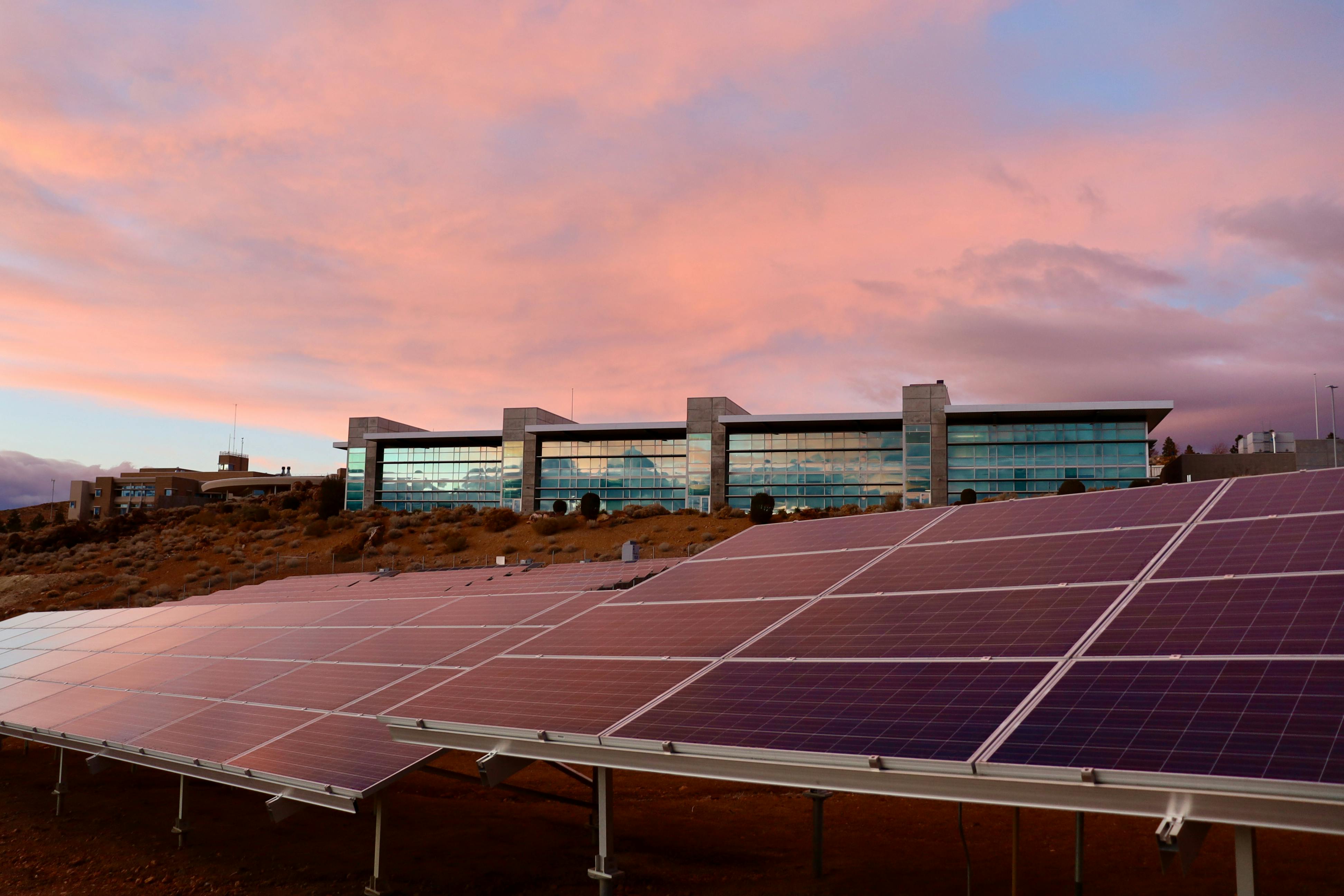 Solar energy panels near a modern building